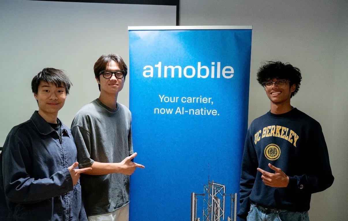 Three builders pointing at the a1mobile banner