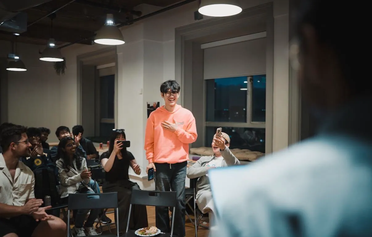 A team demoing to the seated room